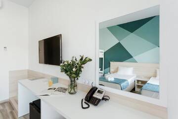 Четырехместный номер с балконом в  Hotel Aquapark Zatoka
